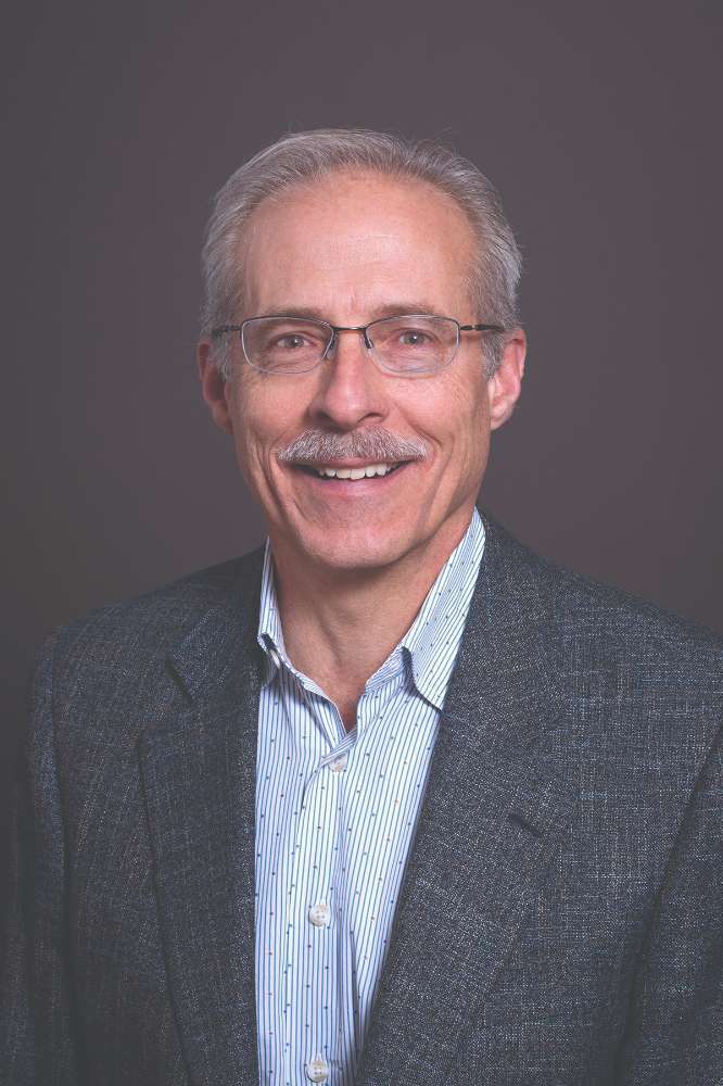 Lyle E Woerth, MD